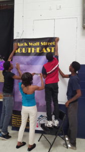 Students from Beverly's Momma's Safe Haven Non-Profit Organization volunteer to help prepare for the 3rd Annual Black Wallstreet Southeast event (June 2016)