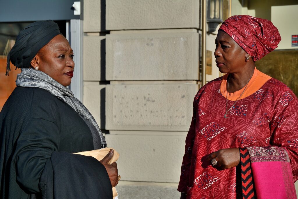 Two older African women dressed in native clothes.