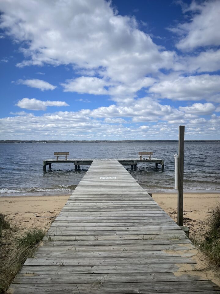 Wooden pier with benches overlooking lake