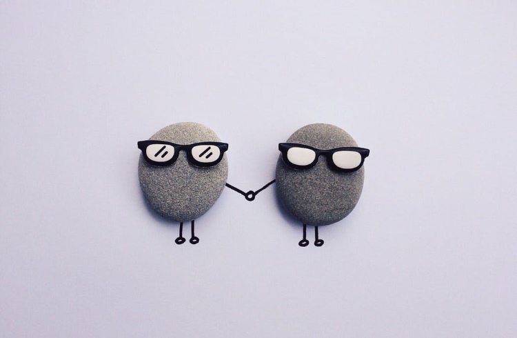 Cute rock characters holding hands